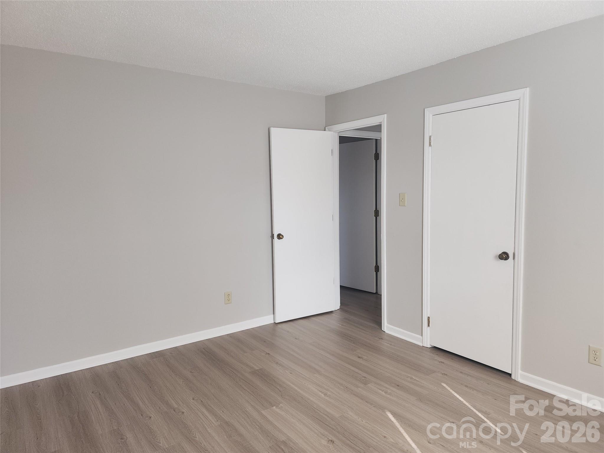 150 Autumn Leaf Road Troutman, NC 28166 - Photo 12 of 21 a view of an empty room with wooden floor