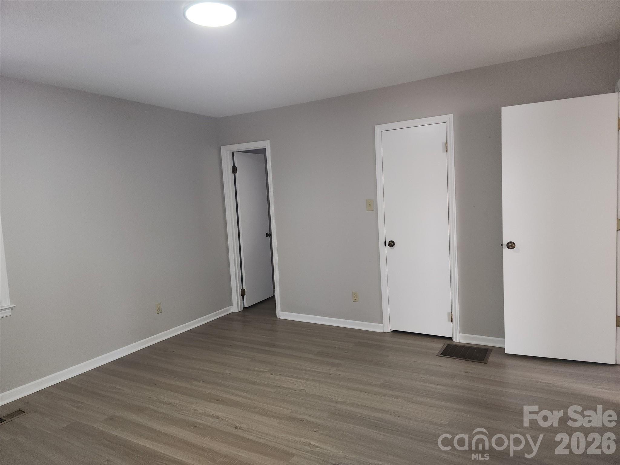 150 Autumn Leaf Road Troutman, NC 28166 - Photo 13 of 21 a view of an empty room with wooden floor