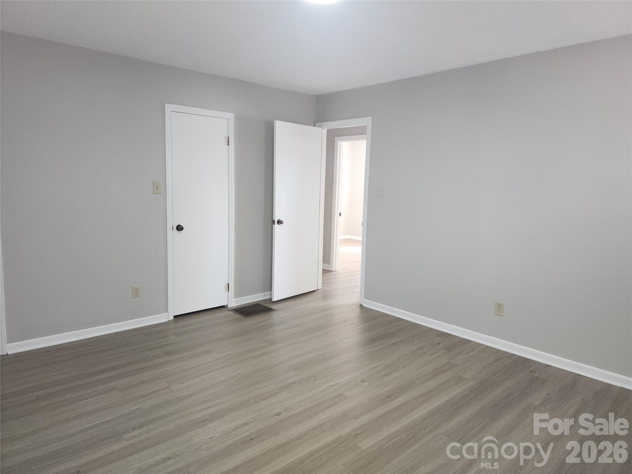 150 Autumn Leaf Road Troutman, NC 28166 - Photo 14 of 21 a view of an empty room with wooden floor