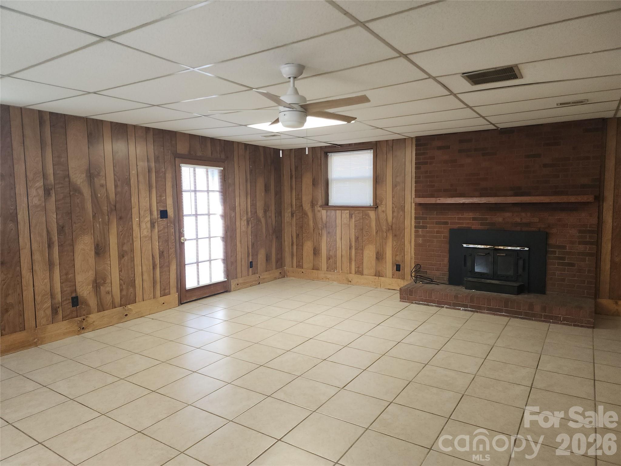 150 Autumn Leaf Road Troutman, NC 28166 - Photo 20 of 21 an empty room with windows and fireplace