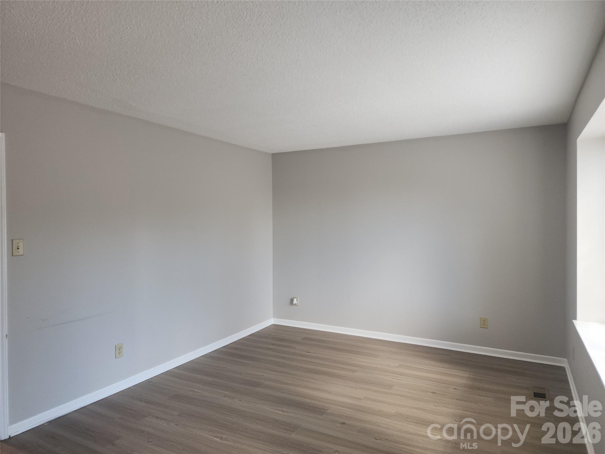 150 Autumn Leaf Road Troutman, NC 28166 - Photo 6 of 21 a view of an empty room and wooden floor