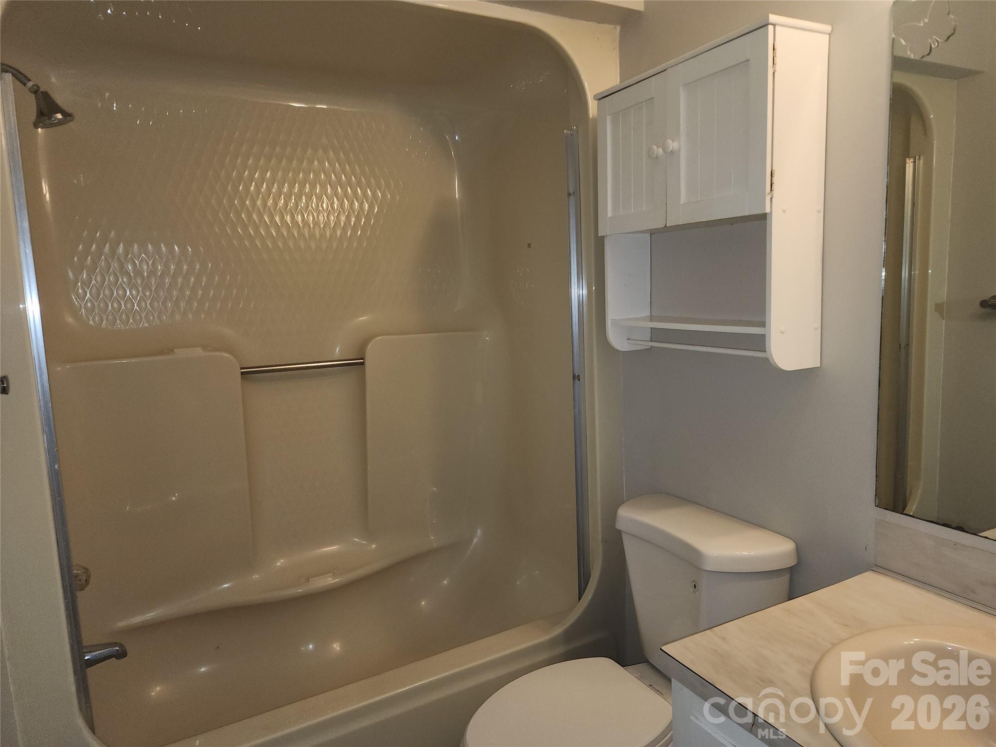 150 Autumn Leaf Road Troutman, NC 28166 - Photo 10 of 21 a bathroom with a toilet and a shower