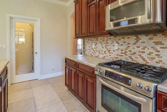 a kitchen with a stove and a microwave