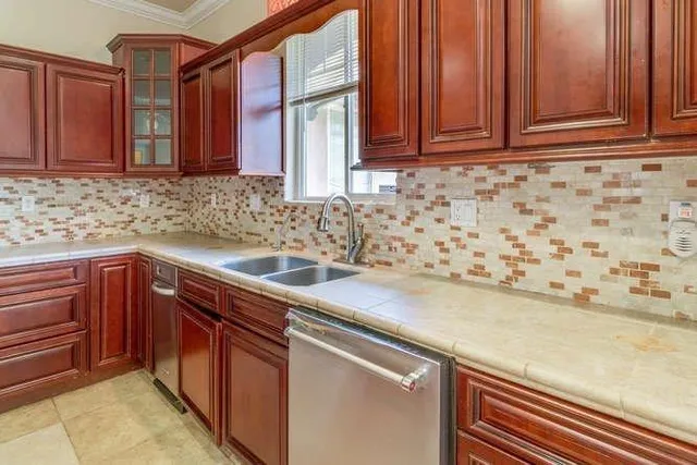 a kitchen with a sink and cabinets
