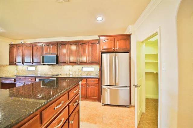 a view of a kitchen with a sink and cabinets