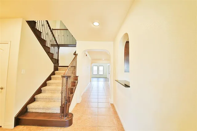 a view of a hallway with staircase