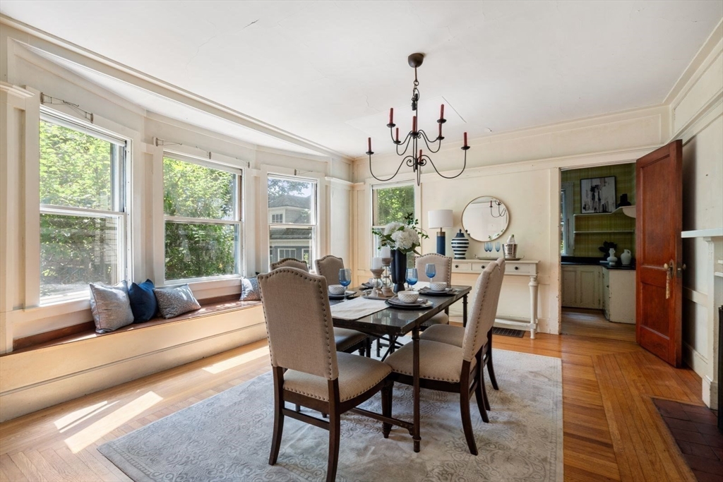 61 Chester Street Newton, MA 02461 - Photo 11 of 42 a view of a dining room with furniture a rug and wooden floor