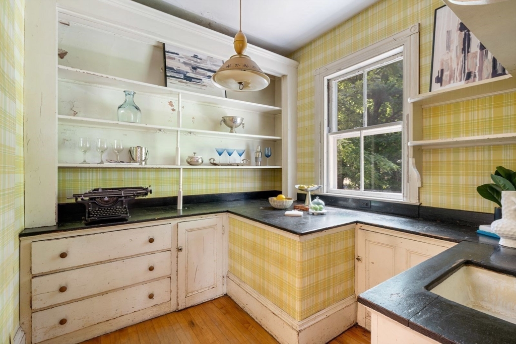 61 Chester Street Newton, MA 02461 - Photo 12 of 42 a kitchen with cabinets and window