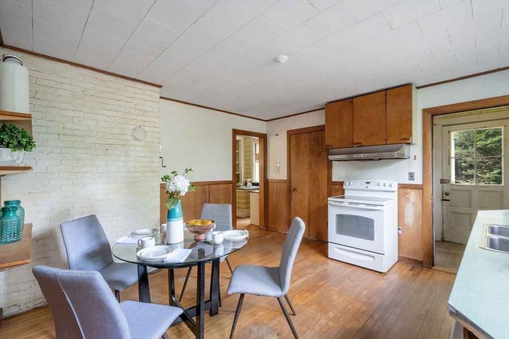 61 Chester Street Newton, MA 02461 - Photo 13 of 42 a view of a dining room with furniture and wooden floor