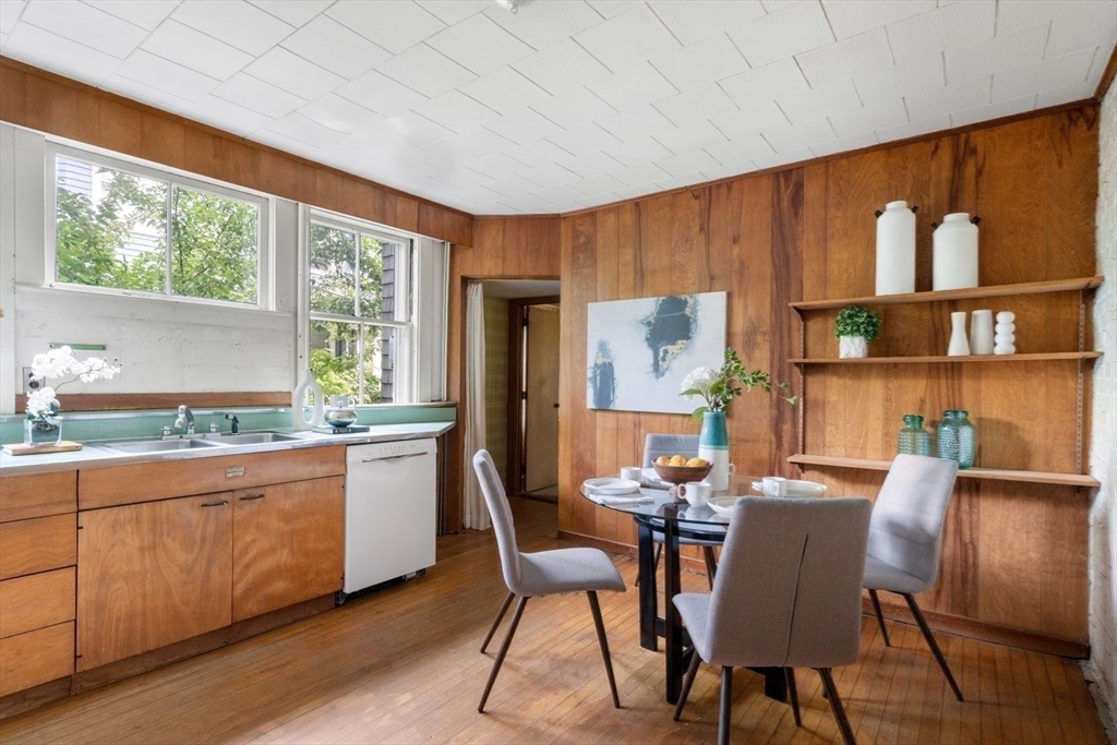 61 Chester Street Newton, MA 02461 - Photo 14 of 42 a dining room with furniture window and wooden floor