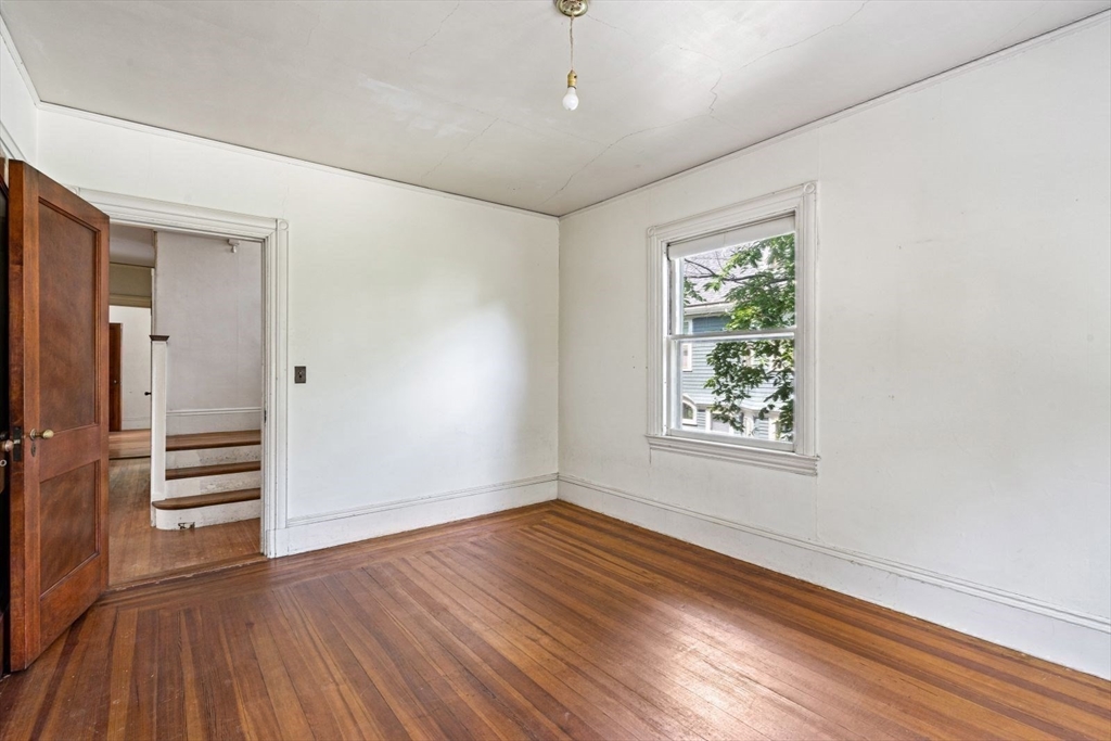 61 Chester Street Newton, MA 02461 - Photo 21 of 42 wooden floor in an empty room with a window