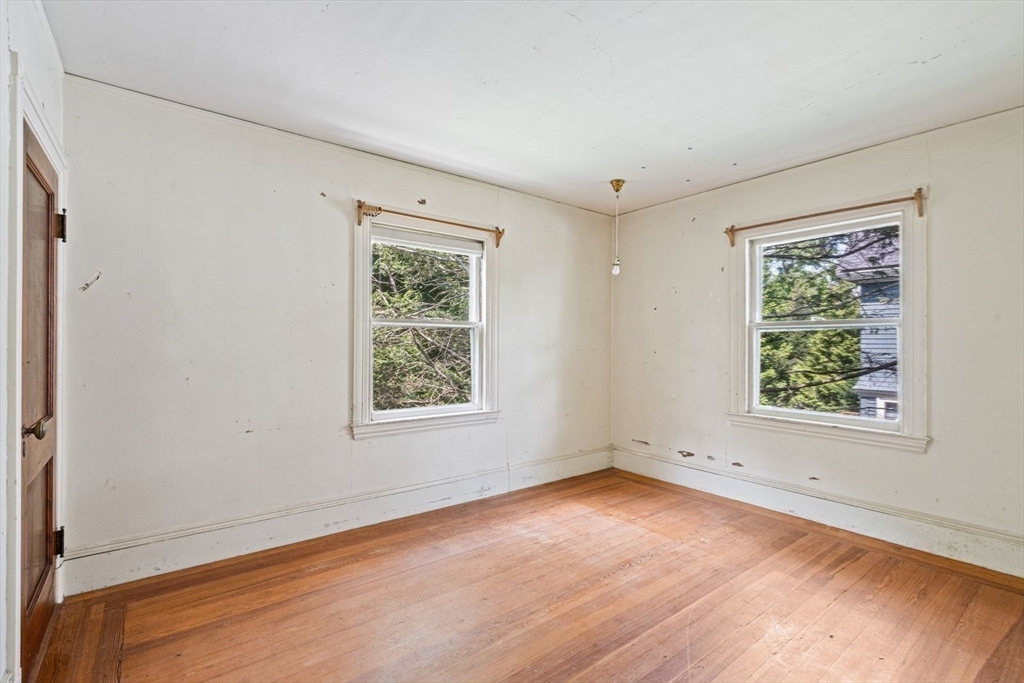 61 Chester Street Newton, MA 02461 - Photo 23 of 42 an empty room with a window