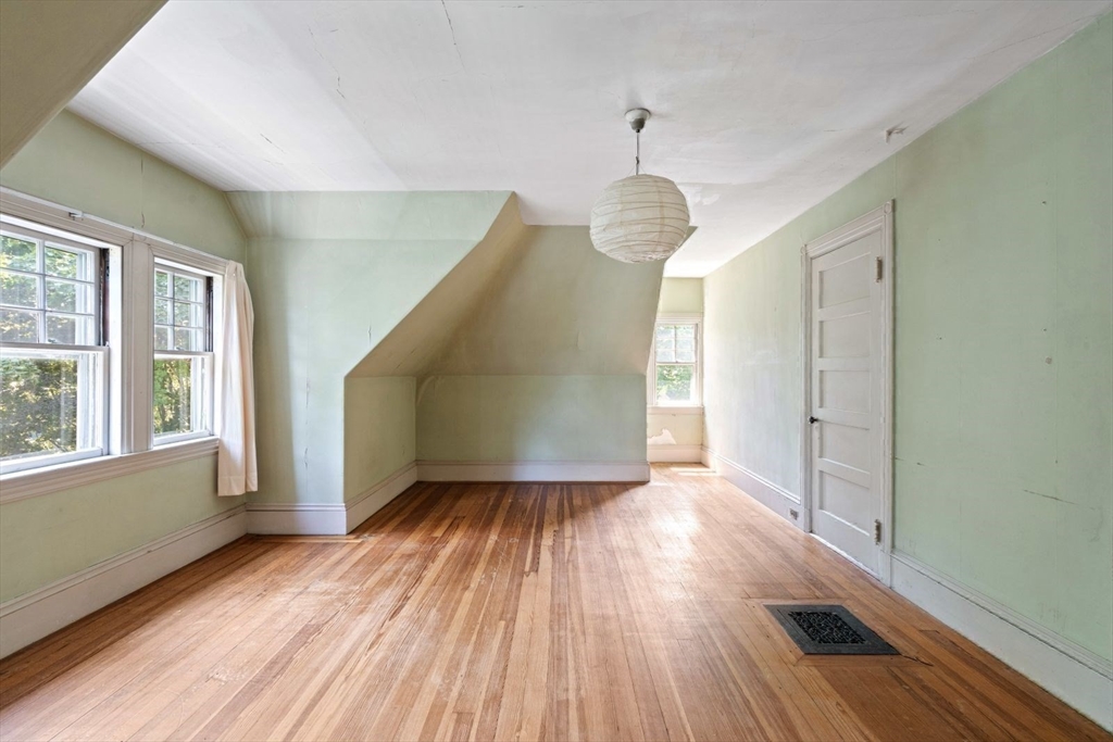61 Chester Street Newton, MA 02461 - Photo 28 of 42 a view of livingroom with hardwood floor and window