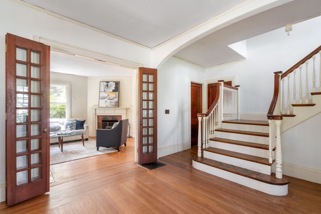 61 Chester Street Newton, MA 02461 - Photo 6 of 42 a view of a livingroom with furniture and stairs