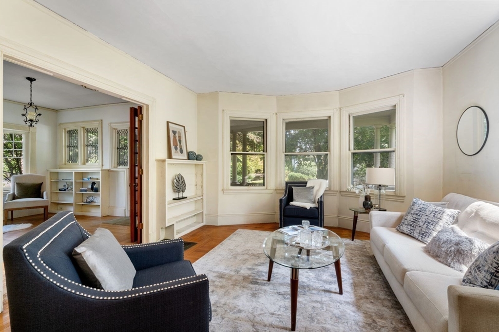 61 Chester Street Newton, MA 02461 - Photo 8 of 42 a living room with furniture and a large window