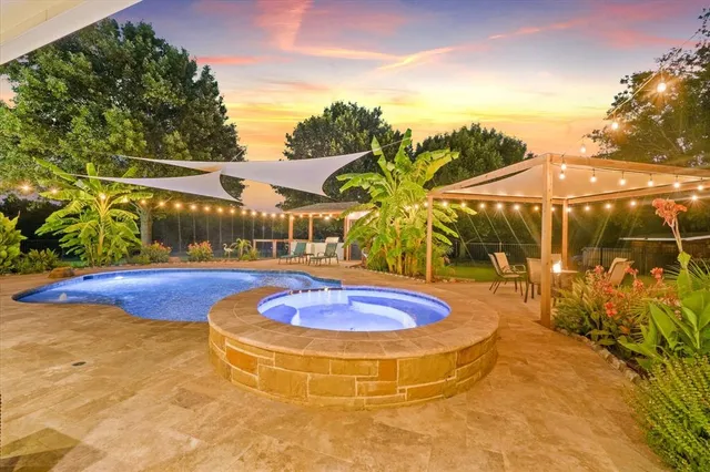 a view of swimming pool with outdoor seating
