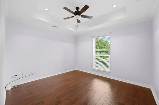 a bathroom with a bathtub shower sink vanity and toilet