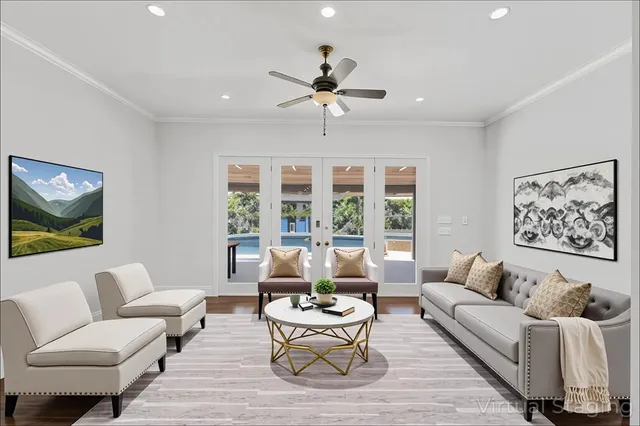 a living room with furniture and a large window