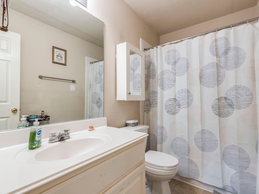 172 Winter Street Kyle, TX 78640 - Photo 11 of 14 a bathroom with a sink and toilet