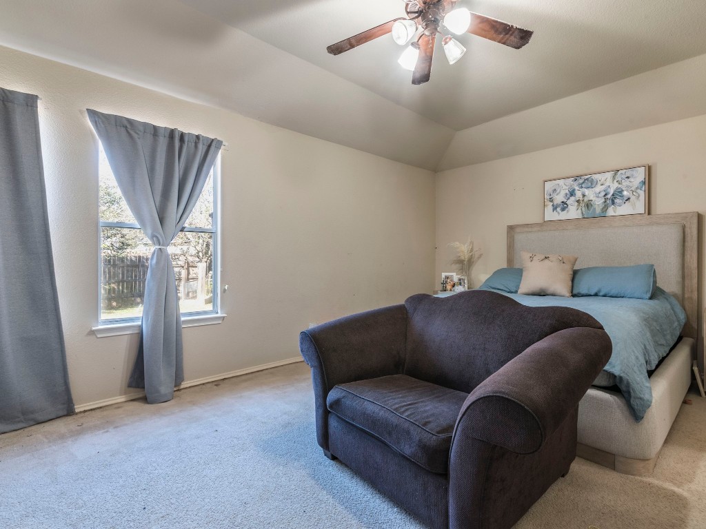 172 Winter Street Kyle, TX 78640 - Photo 8 of 14 a bedroom with furniture and a window