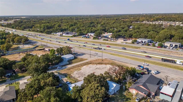 a view of a house with a yard and garage