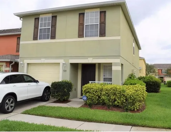 a view of a car in front of a house