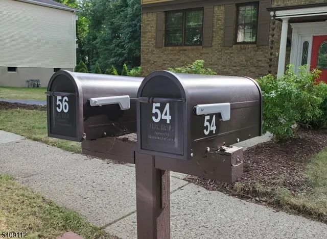 a front view of a house with parking area