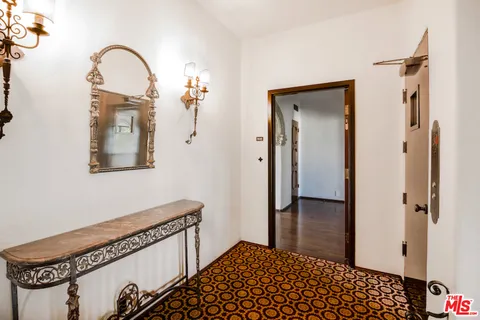 a view of a bedroom from a hallway