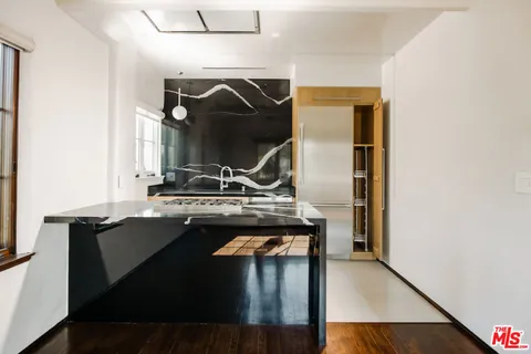 a kitchen with a stove and a microwave