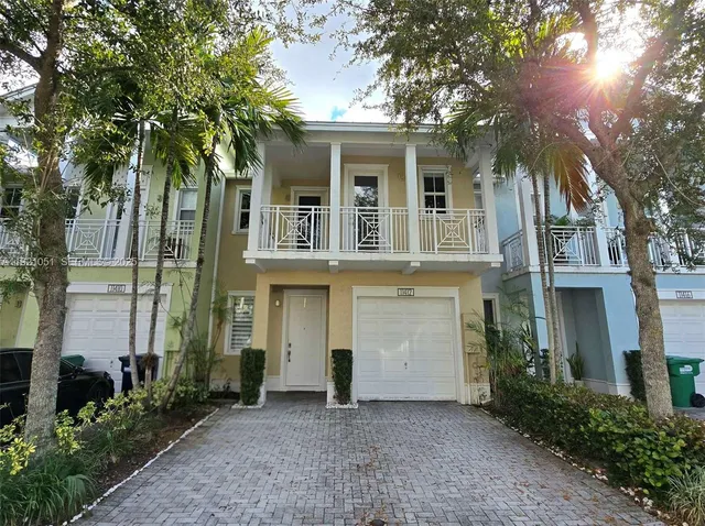 front view of a house with a garden