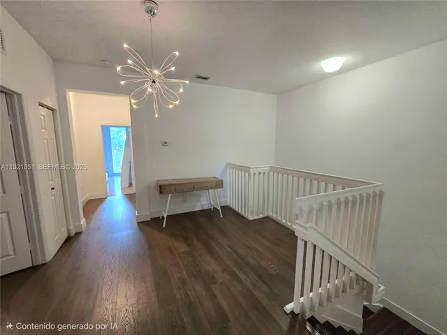 a bedroom with a bed and a mirror