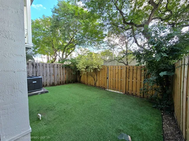 an aerial view of a house with a lake view