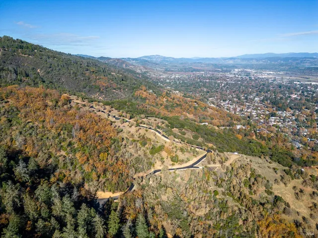 a view of a city with mountains in the background