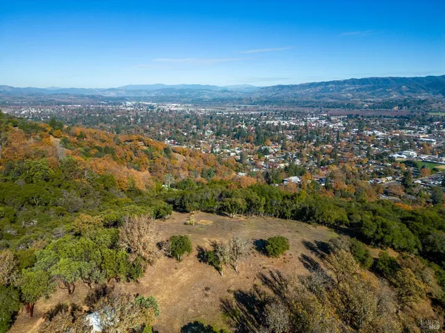 an aerial view of residential house with beach and ocean view