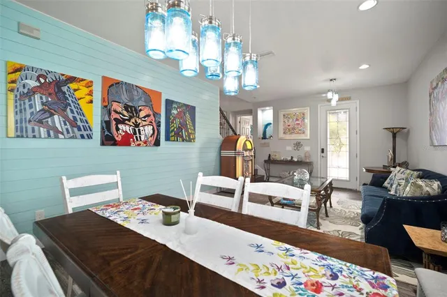 a kitchen with granite countertop cabinets stainless steel appliances a sink and wooden floor