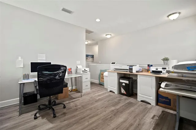 a view of a swimming pool with outdoor seating