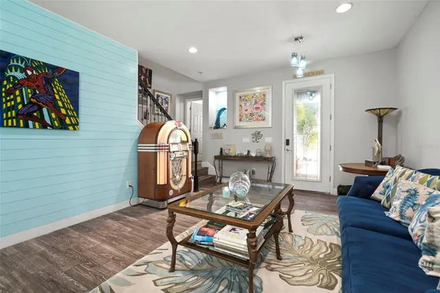 a living room with furniture and a flat screen tv