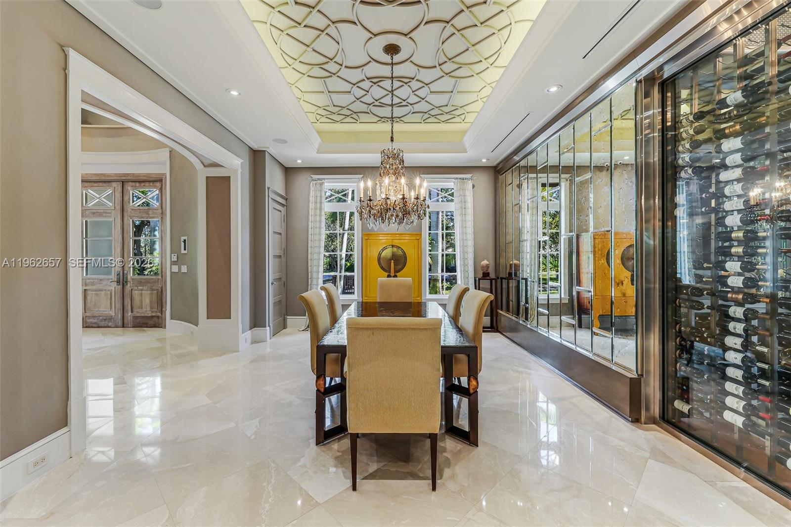 9320 Balada Street Coral Gables, FL 33156 - Photo 11 of 75 a dining room with furniture a chandelier and a rug