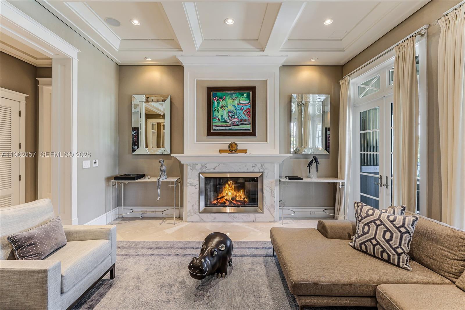 9320 Balada Street Coral Gables, FL 33156 - Photo 15 of 75 a living room with furniture and a fireplace