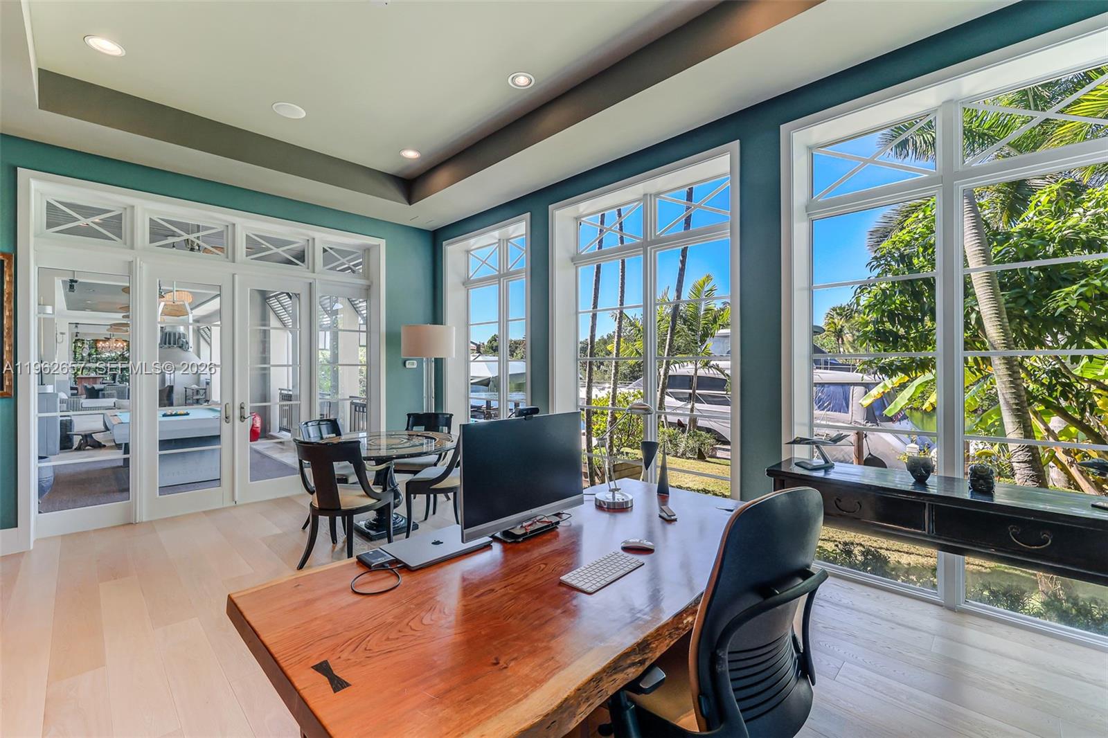 9320 Balada Street Coral Gables, FL 33156 - Photo 18 of 75 a dining room with furniture water view and large windows