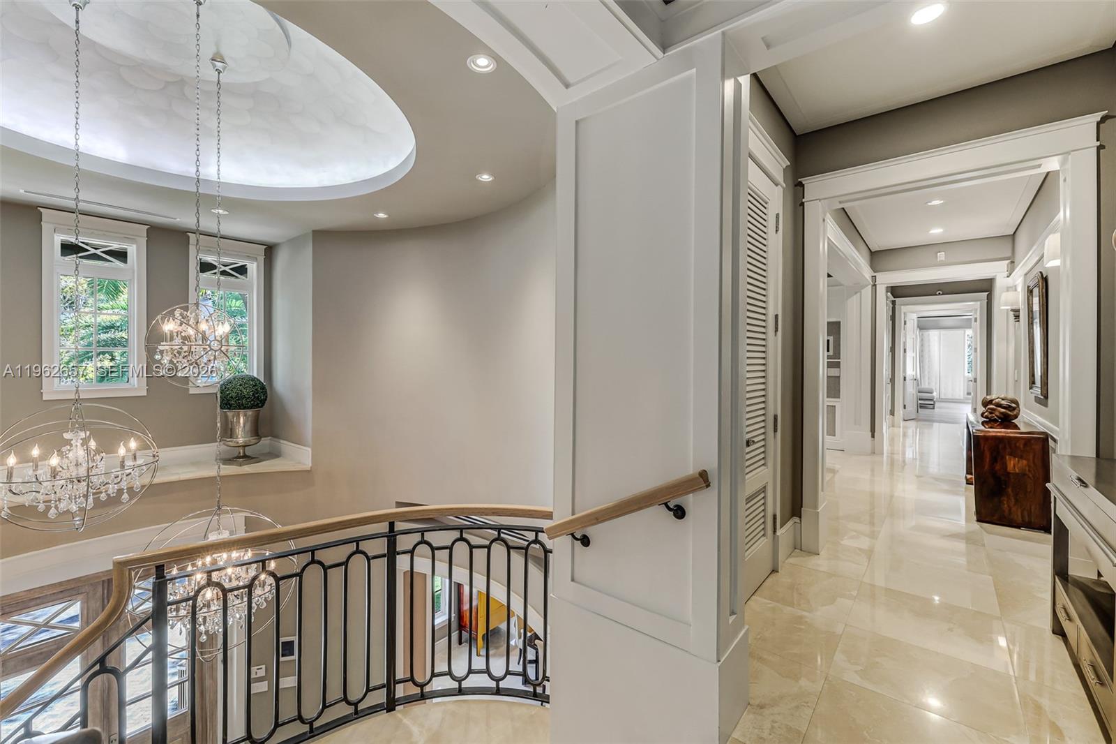 9320 Balada Street Coral Gables, FL 33156 - Photo 30 of 75 a view of a hallway with a chandelier