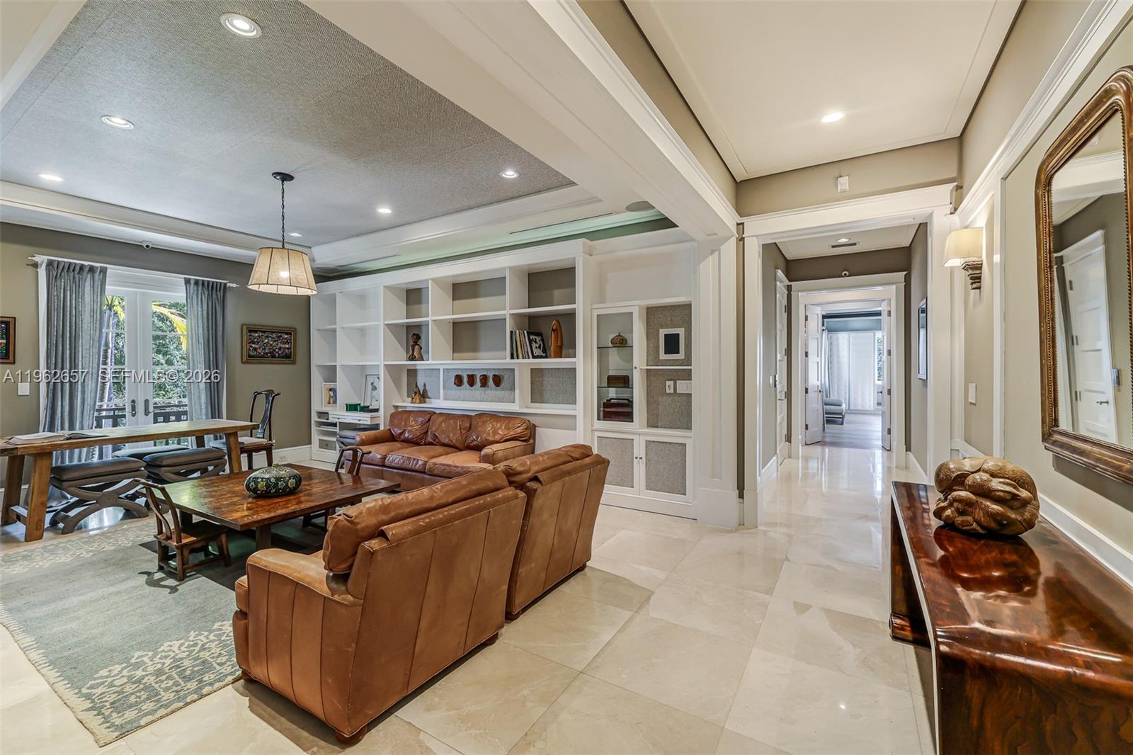 9320 Balada Street Coral Gables, FL 33156 - Photo 31 of 75 a living room with furniture a flat screen tv and large windows