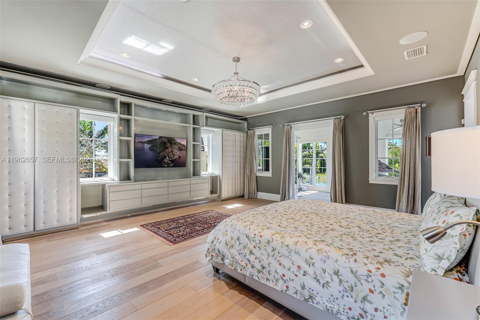 9320 Balada Street Coral Gables, FL 33156 - Photo 33 of 75 a bedroom with a large bed and a large window