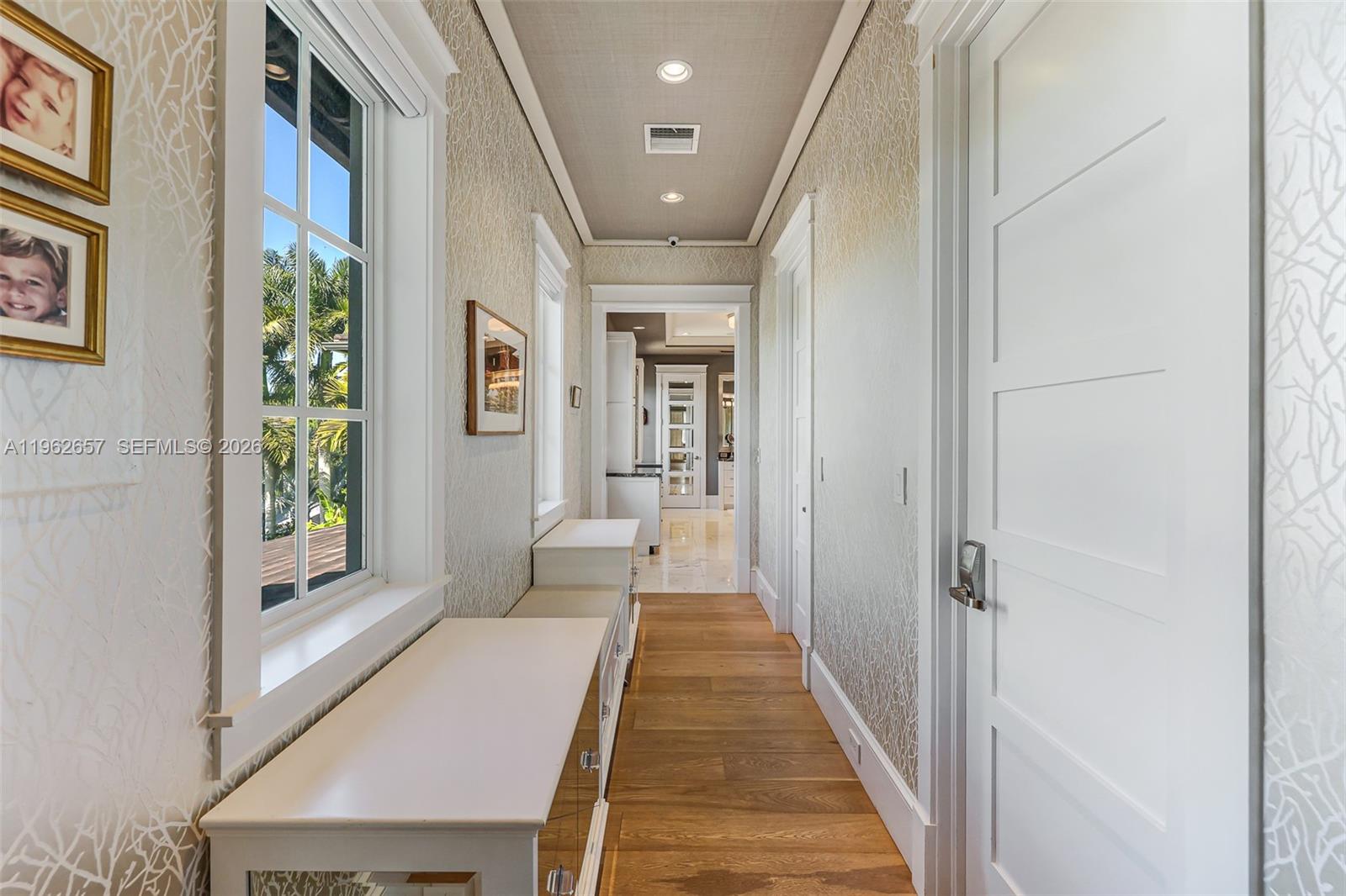 9320 Balada Street Coral Gables, FL 33156 - Photo 38 of 75 a hallway with wooden floor windows and entryway