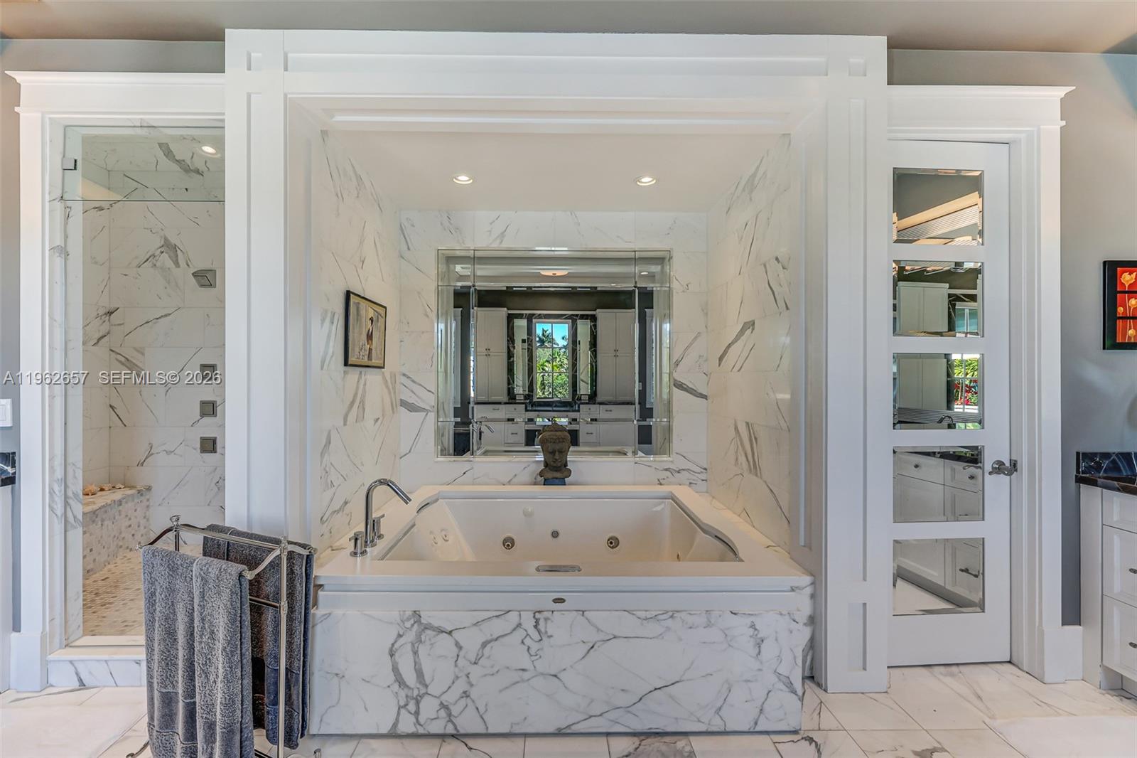 9320 Balada Street Coral Gables, FL 33156 - Photo 41 of 75 a bathroom with a tub sink and mirror