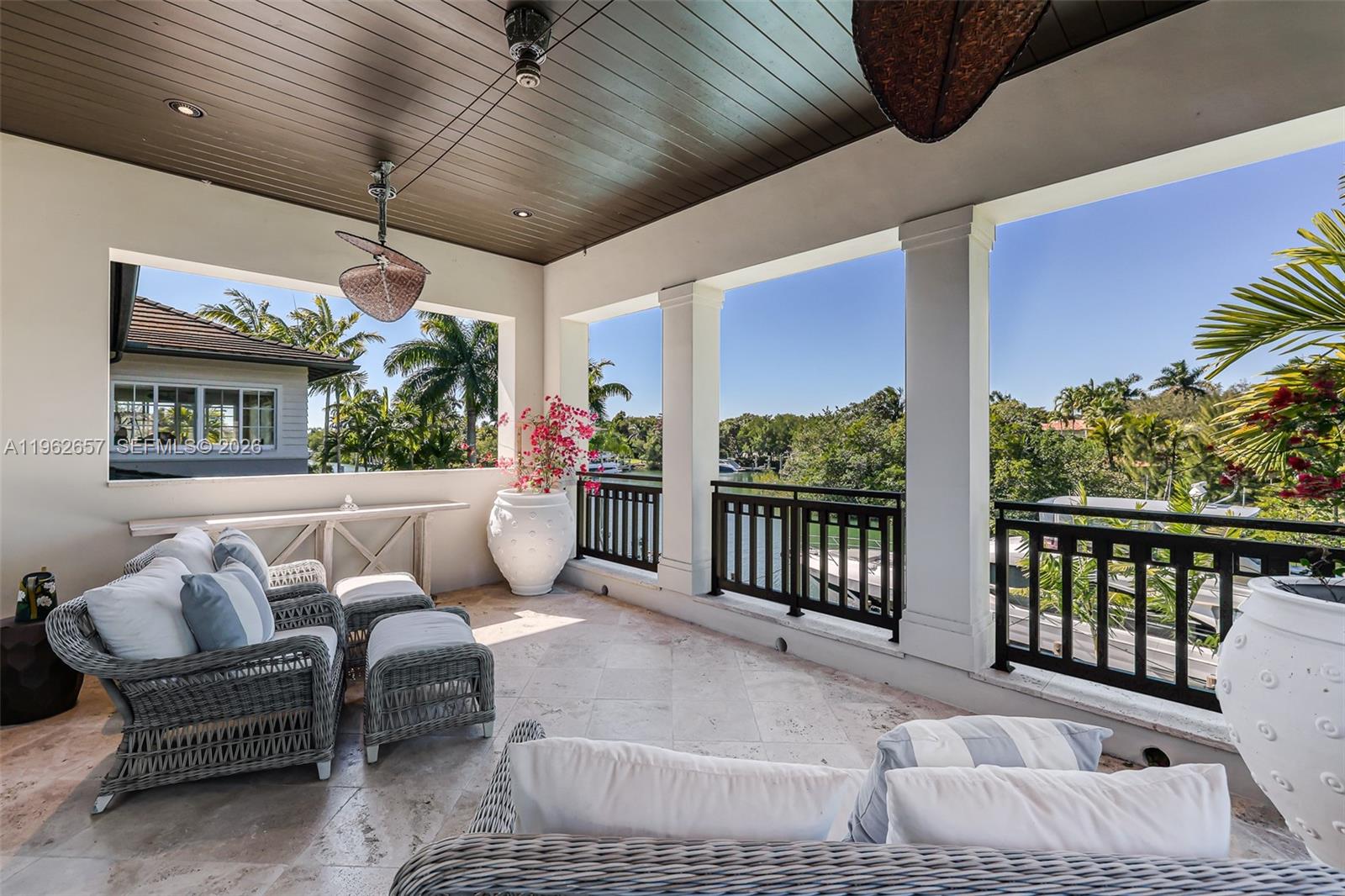 9320 Balada Street Coral Gables, FL 33156 - Photo 46 of 75 a outdoor living space with furniture and a potted plant