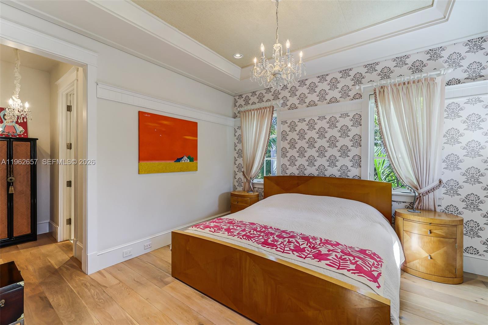 9320 Balada Street Coral Gables, FL 33156 - Photo 48 of 75 a bedroom with a bed chandelier and a window