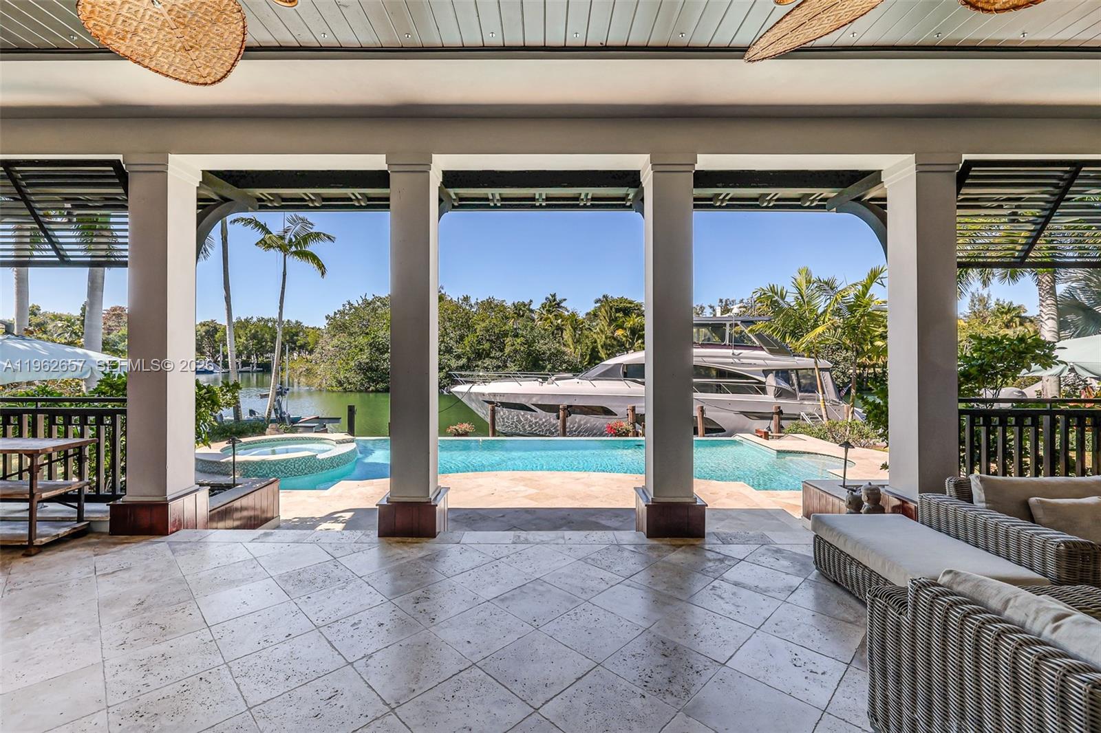 9320 Balada Street Coral Gables, FL 33156 - Photo 50 of 75 a view of a porch with furniture and floor to ceiling window