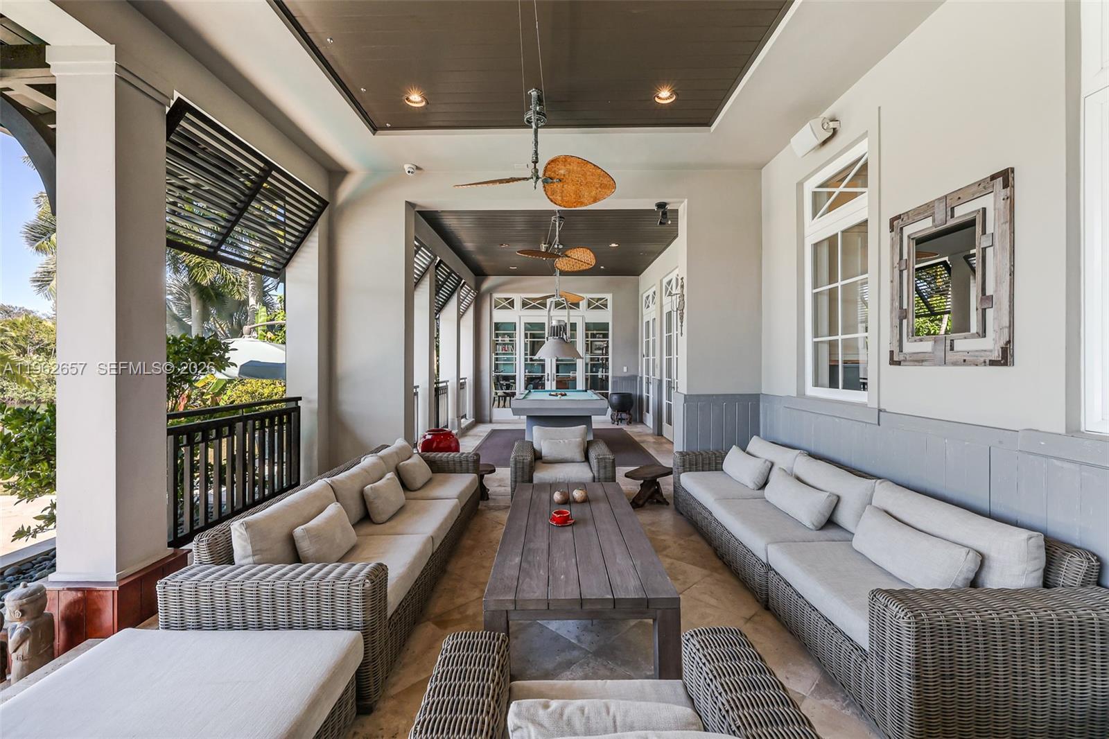 9320 Balada Street Coral Gables, FL 33156 - Photo 51 of 75 a living room with furniture and a large window
