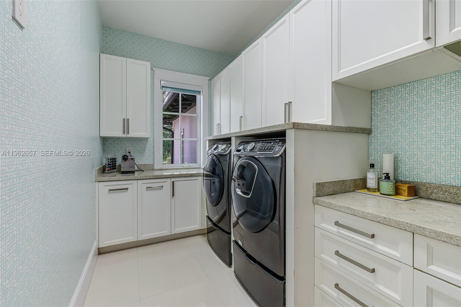 9320 Balada Street Coral Gables, FL 33156 - Photo 57 of 75 a utility room with sink dryer and washer